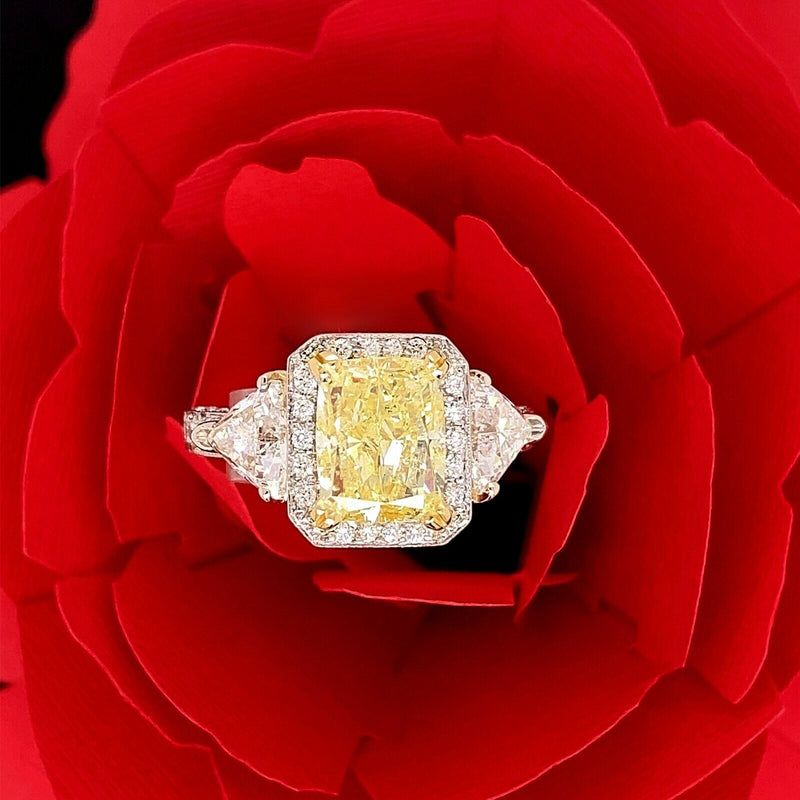 Fancy Yellow Cushion Diamond 4.91 tcw Three Stone Engagement Ring 18kt WG YG