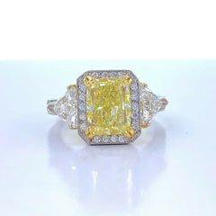 Fancy Yellow Cushion Diamond 4.91 tcw Three Stone Engagement Ring 18kt WG YG